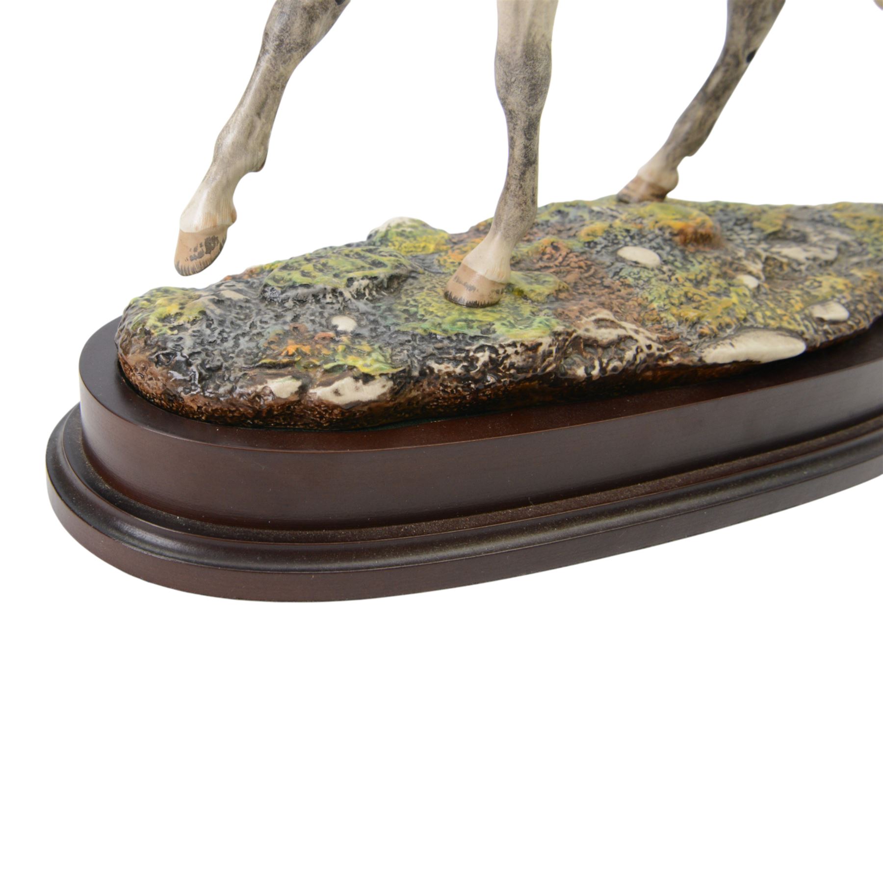 Two Royal Doulton horses, Desert Orchid and Red Rum, on wooden plinths 