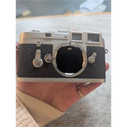 Leica DBP M3 35mm rangefinder camera body, serial no. 1038356, circa 1961, in chrome finish, housed in brown leather Leica case, with a Leitz Wetzlar Sunnilux 1:1.4/50 lens serial no. 1845148, Leitz Wetzlar Elmar 1:4/135 lens serial no. 1825980, 12575N hood, 12521G hood, Leica Meter MC serial no. 99015, Sunpak Auto28 SR Thyristor, Linhof 3 Way Pan tripod, and a Toshiba PE-1 Linear Exposure meter, all housed in an Original Benser Everready Case, most items with instruction booklets 