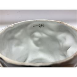 Otto Von Bismarck figural 0.5l stein, his black pickelhaube helmet with chrome spike serving as the lid, in green uniform and gilt detail throughout, pewter thumb hinge, with blue hash Musterschutz type mark, H18cm