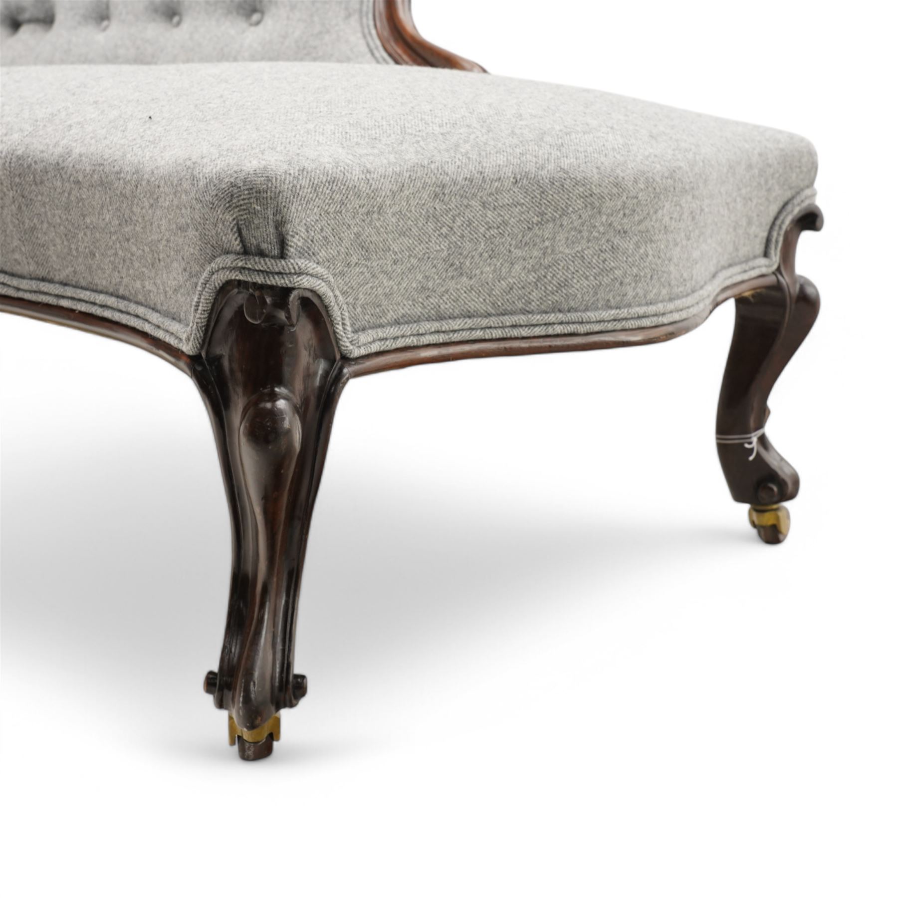 Victorian rosewood framed chaise longue, shaped back upholstered in buttoned herringbone fabric over serpentine fronted seat, scrolled cabriole arm terminals and supports terminating to ceramic castors 