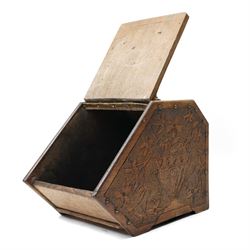 Arts & Crafts period oak coal box, each side carved with urn and spilling flowers, the cover with typical motifs, single carrying handle 