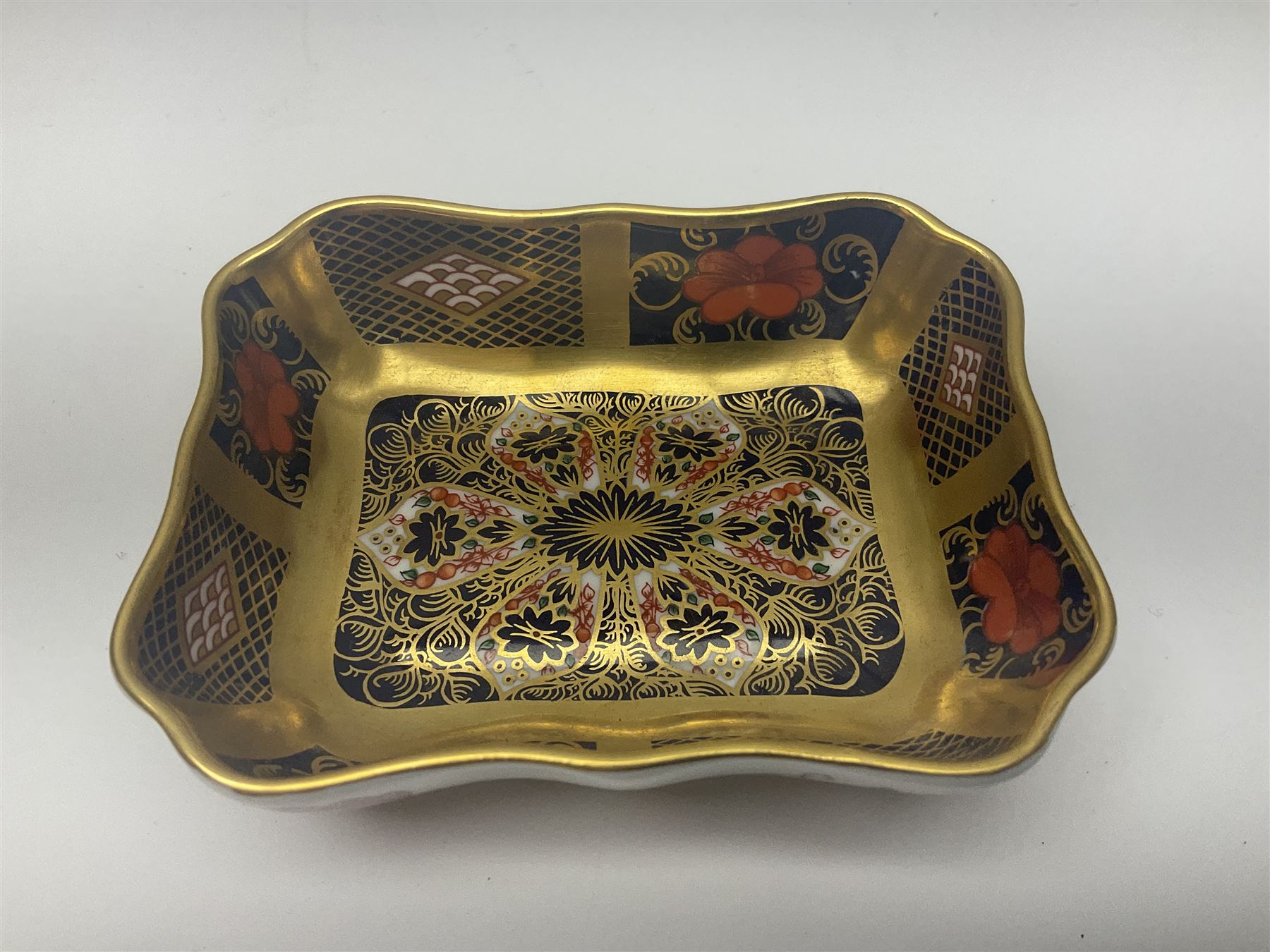 Royal Crown Derby Imari pattern 4971, cup and saucer, circa 1913, together with Royal Crown Derby Imari pattern 1128, trinket dish, circa 1978, both with printed mark beneath 