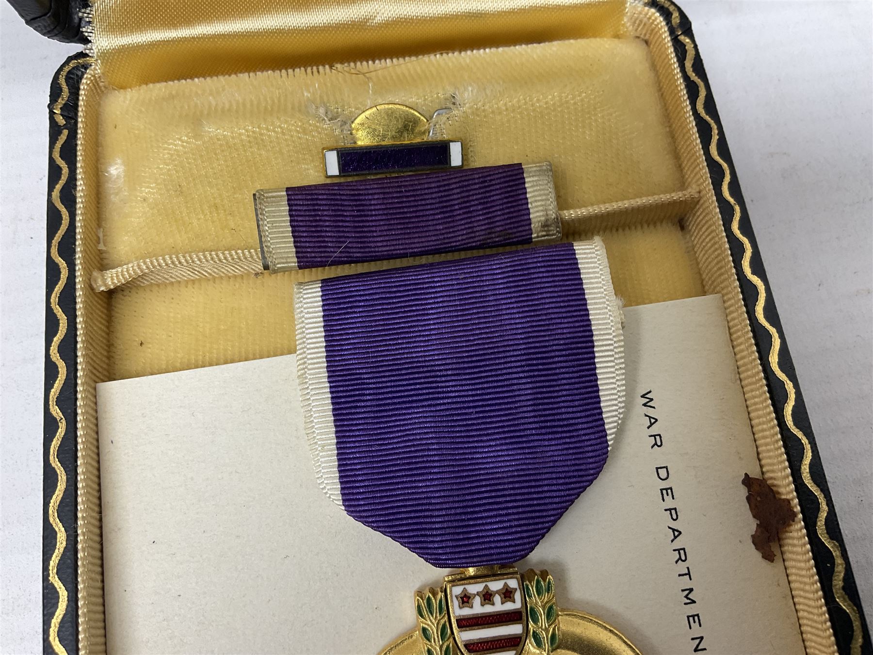 American Purple Heart Medal awarded to 32634848 Charles H. Poppo; cased with identity tags and paperwork; and Bronze Star Medal awarded to U.S. Marine Esteban T. Maranao; cased; American WWII Victory Medal and Asiatic Pacific Campaign Medal