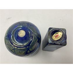 Two Isle of White glass vases, by Alum Bay Glass, both with blue swirl design upon an iridescent mottled blue/green ground, together with a Gozo Glass vase of pebble form, with similar design, H12cm