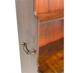 George III mahogany waterfall bookcase on cupboard, three raised shelves over double cupboard, enclosed by two panelled doors, fitted with brass carrying handles, on bracket feet