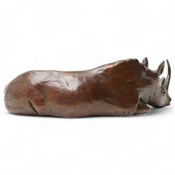 Donald Greig (South African 1959-): Recumbent White Rhino, bronze, signed, 2007,  5cm x 12cm with certificate