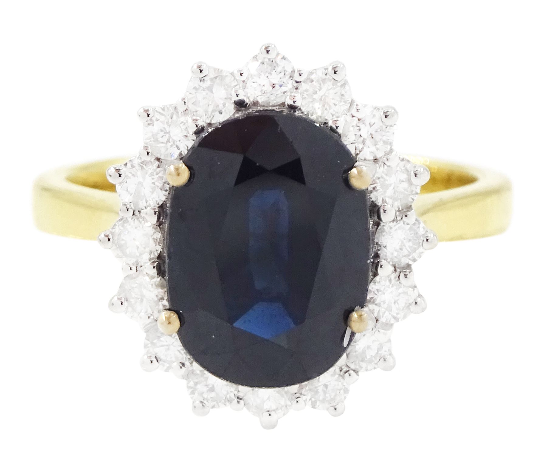 18ct gold sapphire and diamond cluster ring, single oval cut sapphire of approx 2.60 carat, surrounded by sixteen round brilliant cut diamonds, hallmarked, total diamond weight approx 0.45 carat