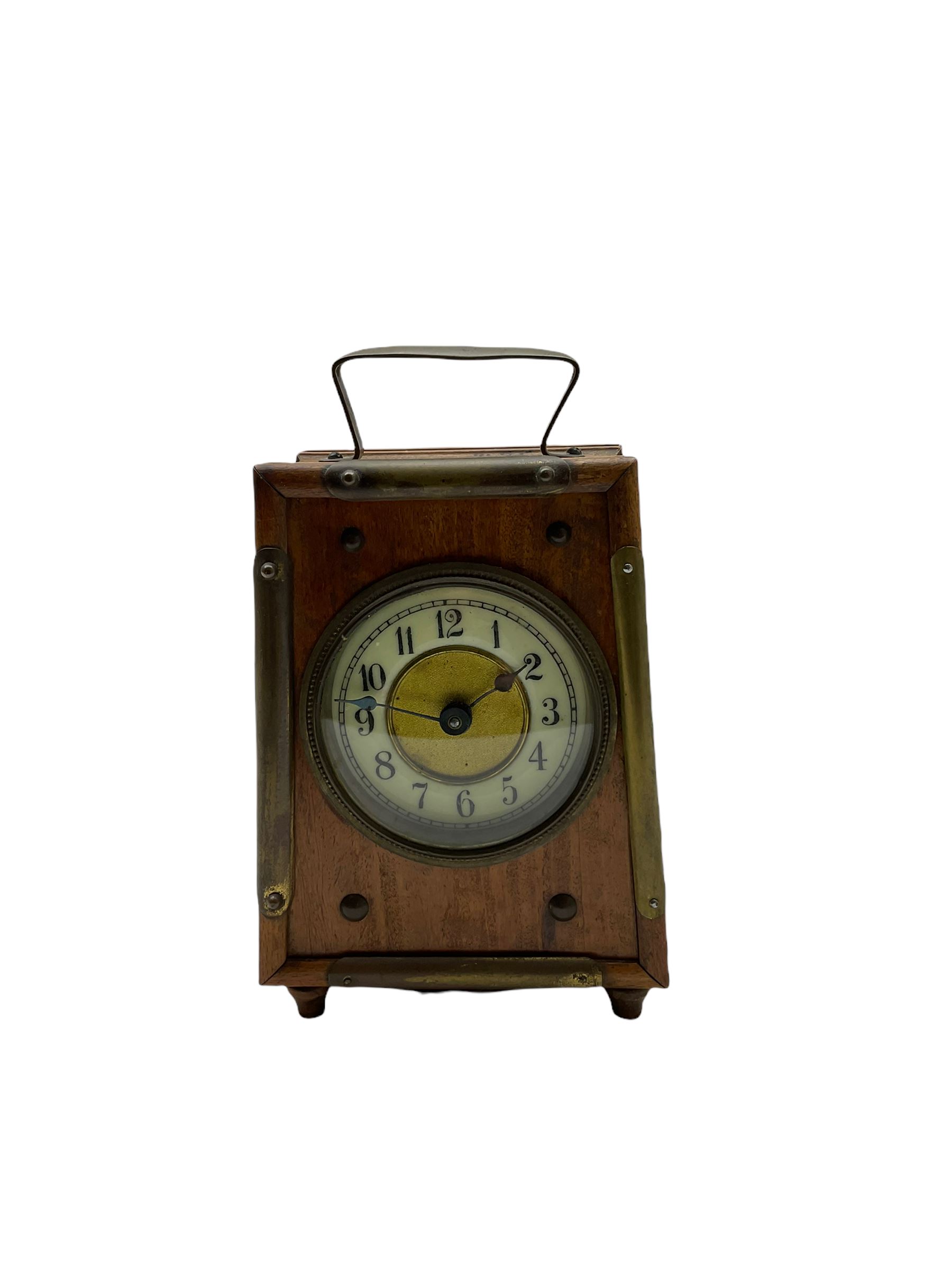 An American “Jerome” late 19th century  30-hour spring driven steeple clock with alarm, in a mahogany case with a decorative glass tablet depicting a rose painted white dial with roman numerals and minute track, steel moon hands and a brass alarm setting disc to the centre. With pendulum and key.
H40 W20 D10
With a small portable 19th century German “Wutternberg” alarm clock, the piece dial with a gilt centre and Ivorine chapter ring, Arabic hours and minute band, wooden case with brass fittings and carrying handle on four feet, wound and set from the rear with integral keys, alarm sounding on a bell. 
H20 W12 D7
