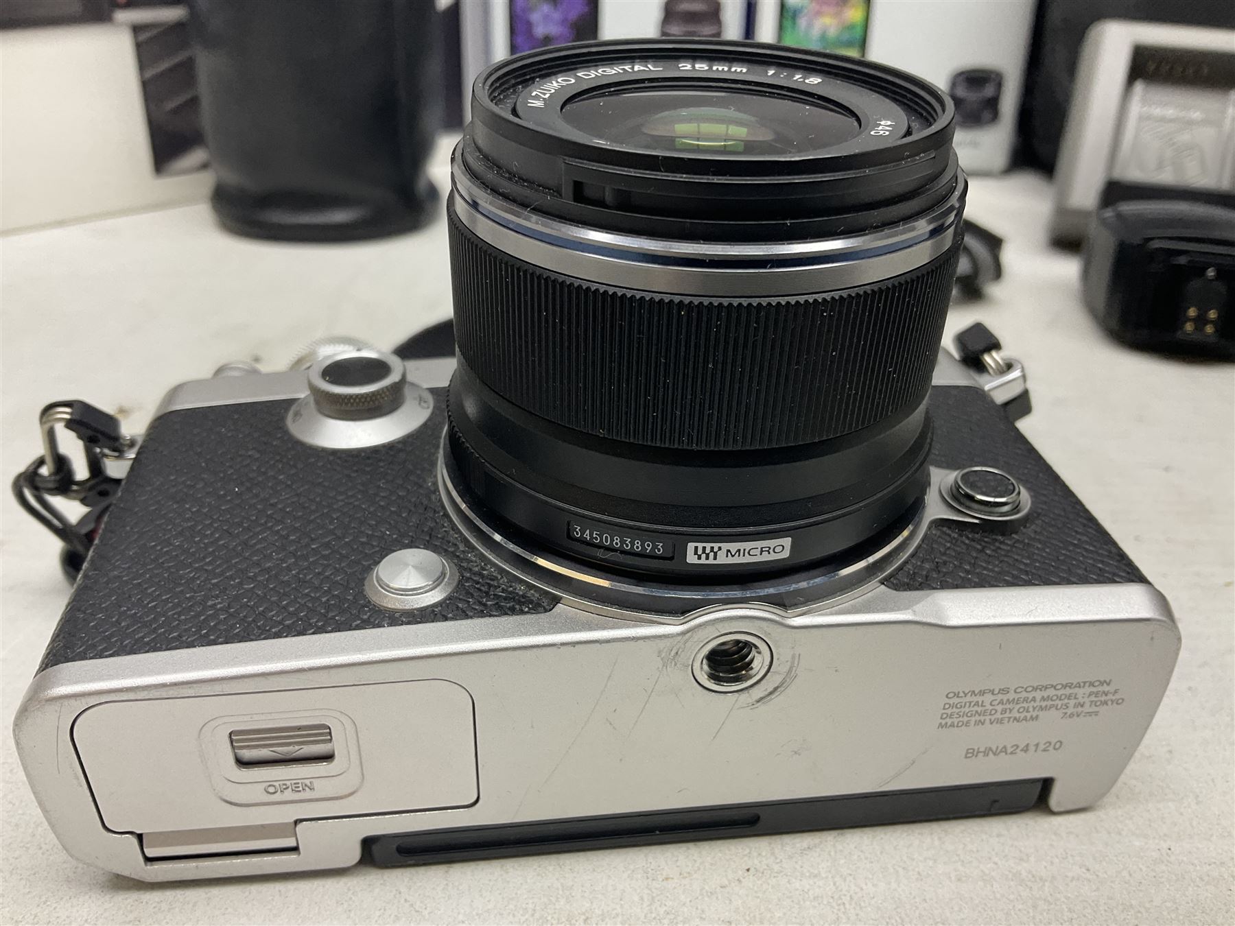 Olympus PEN-F camera body, with 'Olympus M- Zuiko Digital 25mm 1: 1.8' lens,  'Olympus M- Zuiko Digital 75-300mm 1: 4.8 - 6.7' lens and  'Olympus M- Zuiko Digital 17mm 1: 1.8' lens, with original box, together with Lowepro camera bag