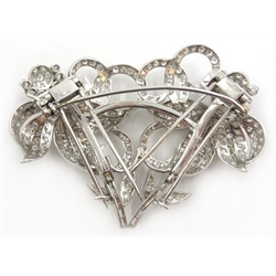  Mid 20th century diamond double brooch/hair clip, the round and baguette diamonds set as two posies in platinum on separate frame 7cm x 5cm  