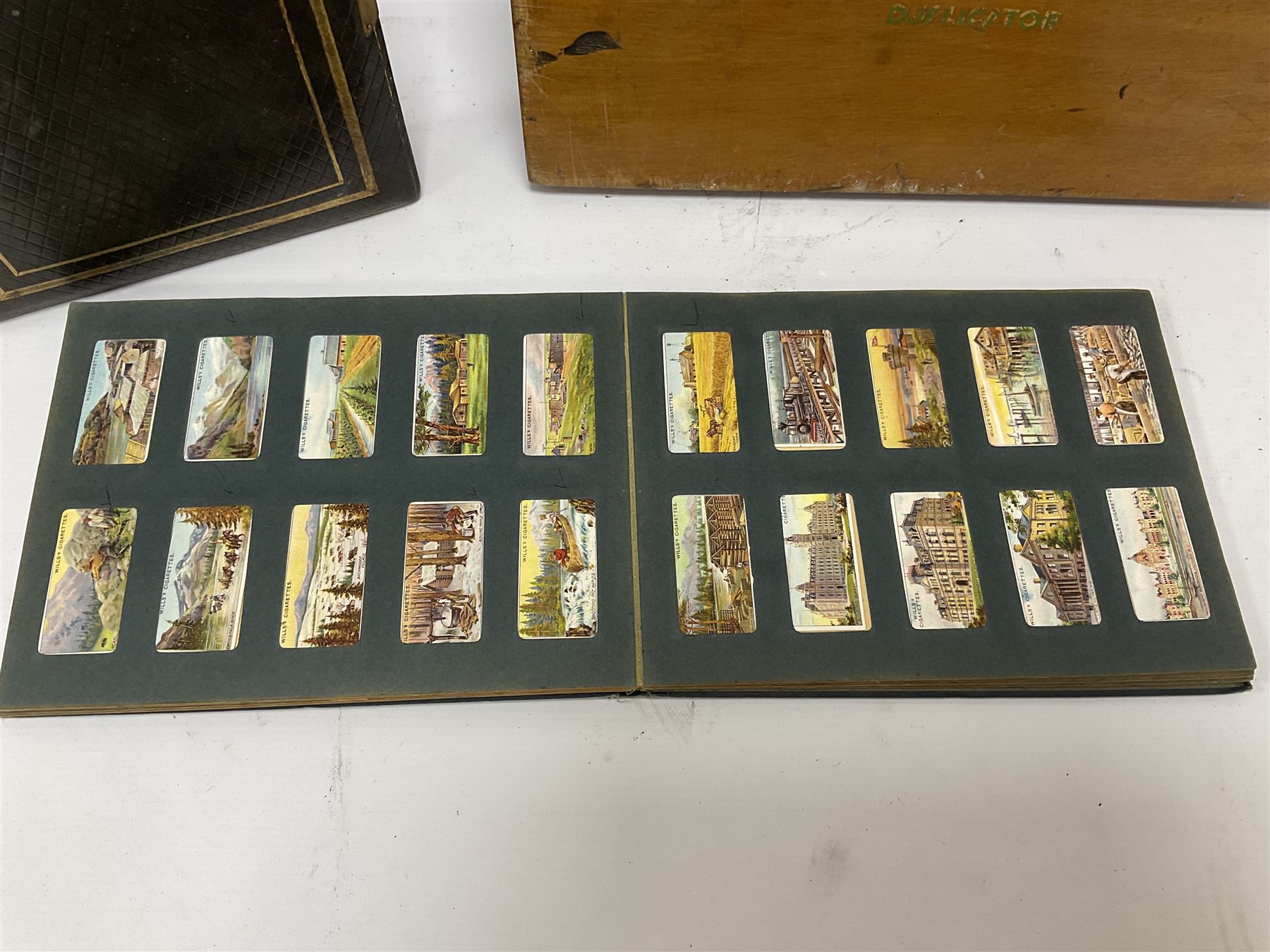 No 2 model Ellams Duplicator Ban Tam, together with a leather bound photo album and a 'Wills's cigarette card Album' full of cigarette cards