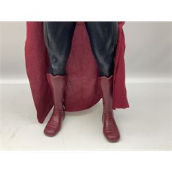 Composite Superman with cape, together with a composite female statue holding the American flag, tallest example H103cm