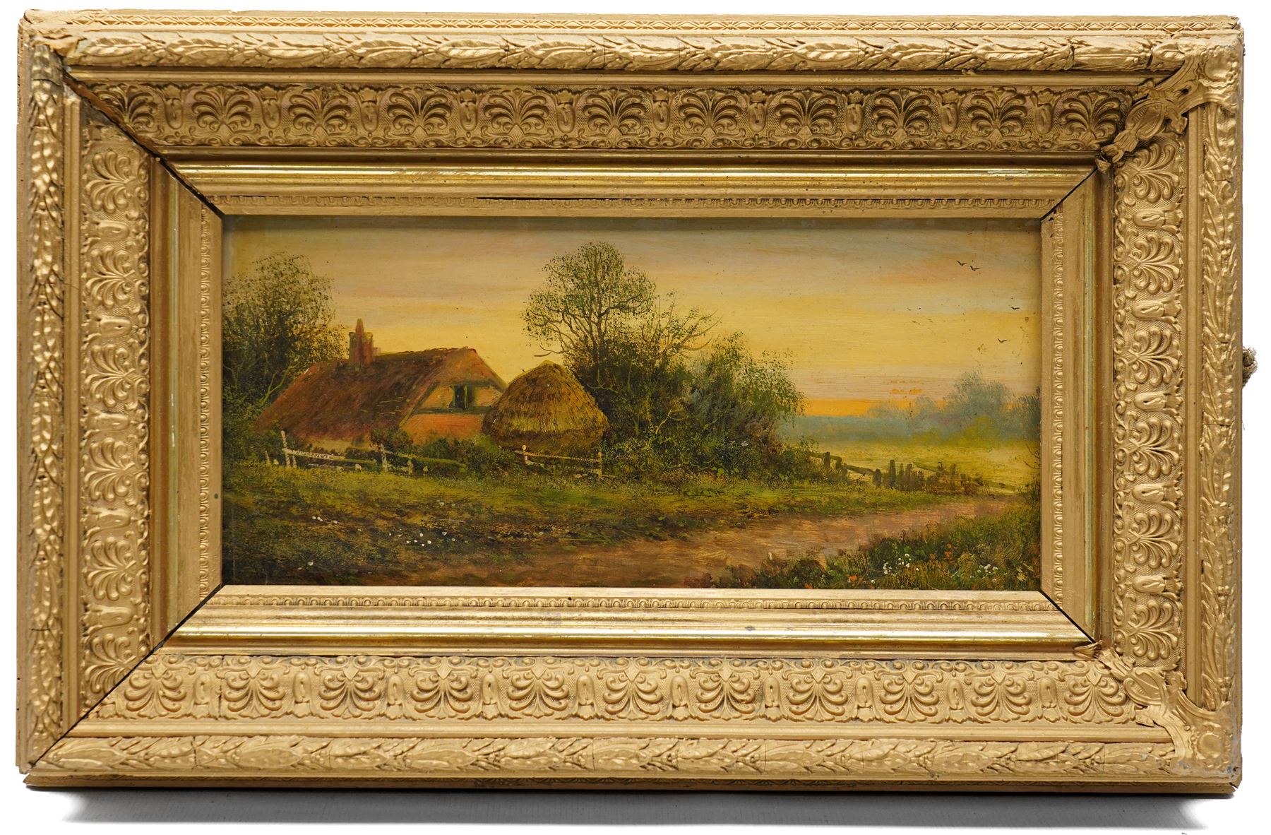 Fred Hines (British 1875-1928): Landscape with Thatched Cottage, oil on board signed; together with Ed Norton (British 19th/20th Century): ‘Poppy Land’, signed titled and dated max 19cm x 40cm (2) (one unframed)