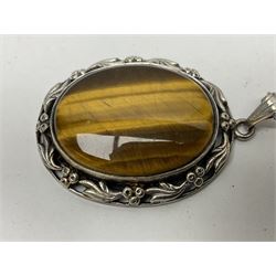 Gold Chinese pendant, silver tiger's eye pendant necklace and a similar silver moss agate pendant