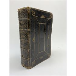 Early 18th century Holy Bible. 1711. London. Printed by The Assigns of Thomas Newcomb and Henry Hills, deceas'd. Printers to the Queens Most Excellent Majesty. Engraved title page. Red lined pages. Full tooled leather/gilt binding with aeg.