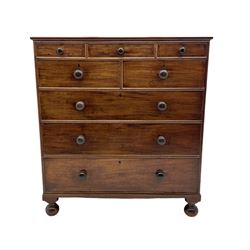 19th century mahogany chest, fitted with thee small crossbanded drawers, above two short and thee long drawers, turned bun feet