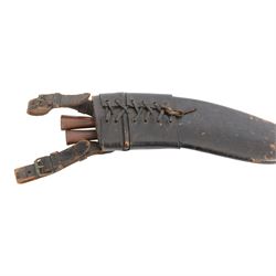 Two WWII Kukri knives, wooden grip with brass cap to pommel, single edged curved blade, within leather scabbard with belt attachments, overall L40cm 