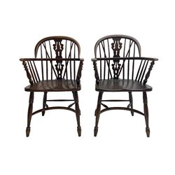 Pair late 20th century oak Windsor elbow chairs, double hoop and stick back with pierced and fretwork work splat, dished seat on turned supports joined by crinoline stretcher