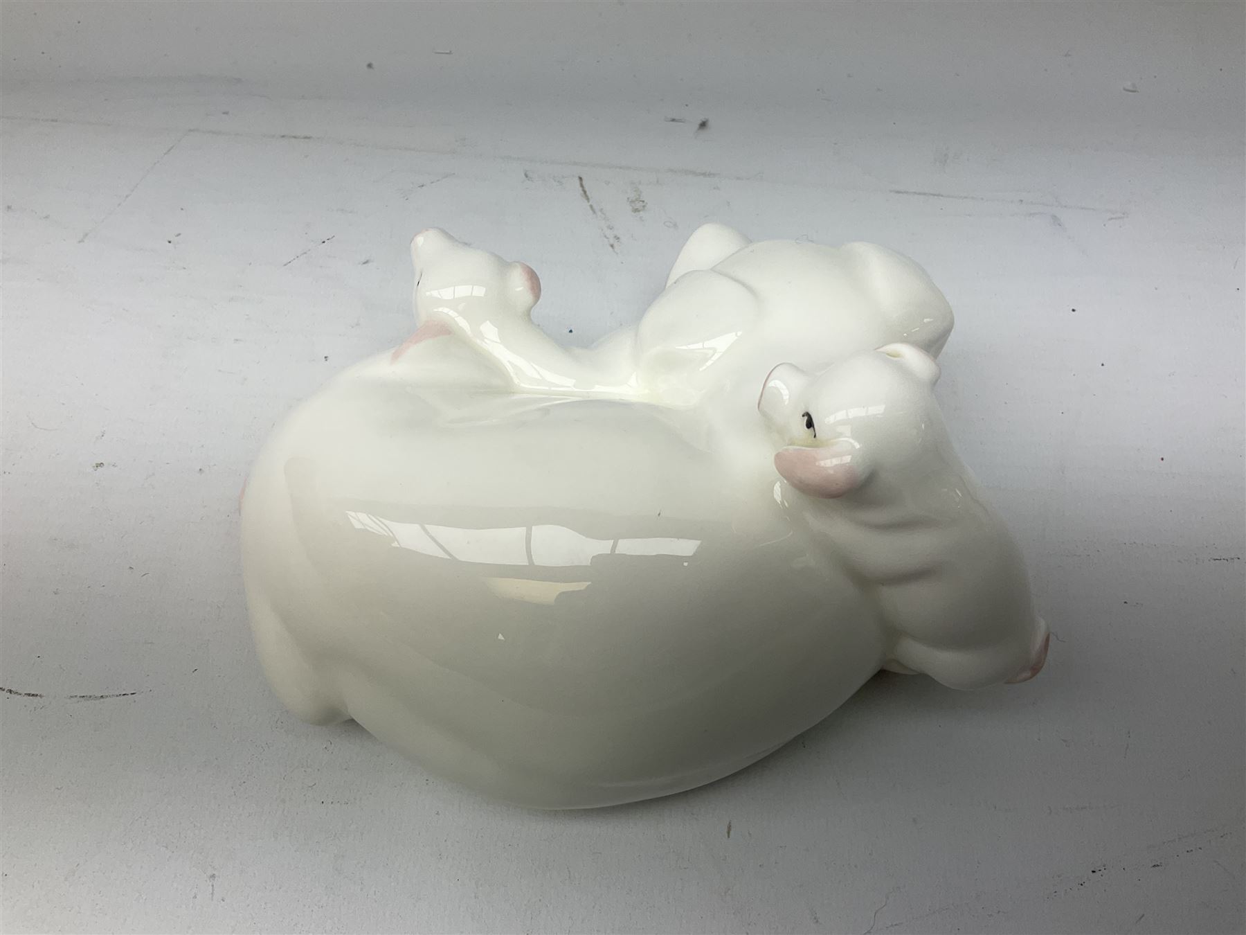 Collection of Beswick pig figures, to include John Beswick Little Likeables ‘Hide and Sleep’, white boar pig and John Beswick trio of pigs, all marked beneath (5)