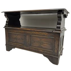 17th century design stained oak monks bench, hinged metaphoric table back, over hinged box seat compartment, the panelled front carved with foliate decoration and lozenges