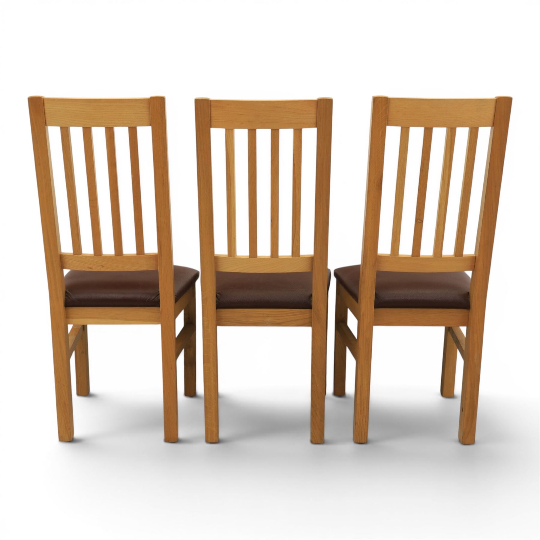 Modern solid oak dining table with set six chairs, chairs with brown leatherette seat