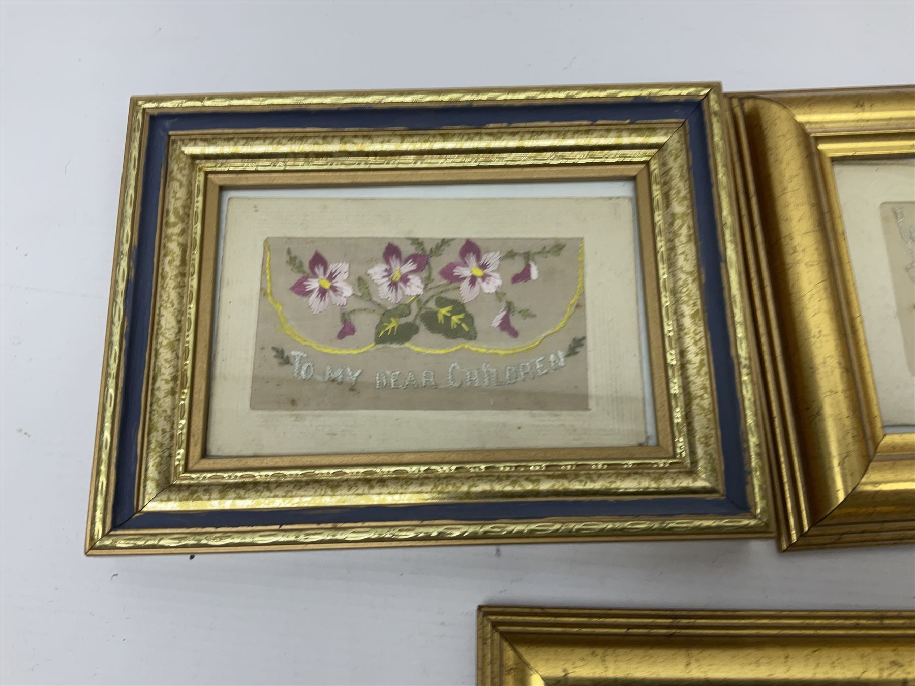 Collection of twenty eight, mostly WWI period embroidered silk greetings cards and postcards, including 'A kiss from France', good luck, sweetheart and Christmas examples, all within modern gilt frames