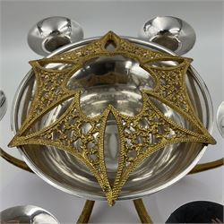 Modernist silver plated candelabra centrepiece by Stuart Devlin, with six pierced gilt branches supporting a central tapering cylindrical rose bowl and six fluted candle holders, with detachable star shaped gilt cover, stamped SD, TG to underside of central bowl, overall H17cm