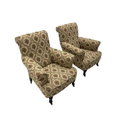 Early 20th century two seat drop arm sofa (W152cm), and pair of
matching armchairs (W83cm), upholstered in beige patterned fabric