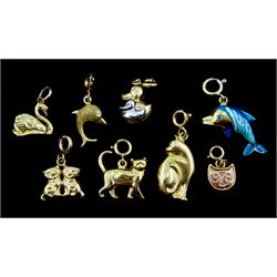 14ct gold duck charm and seven 9ct gold charms including two dolphins, four cats and a swan, all with spring loaded clasps and stamped or hallmarked
