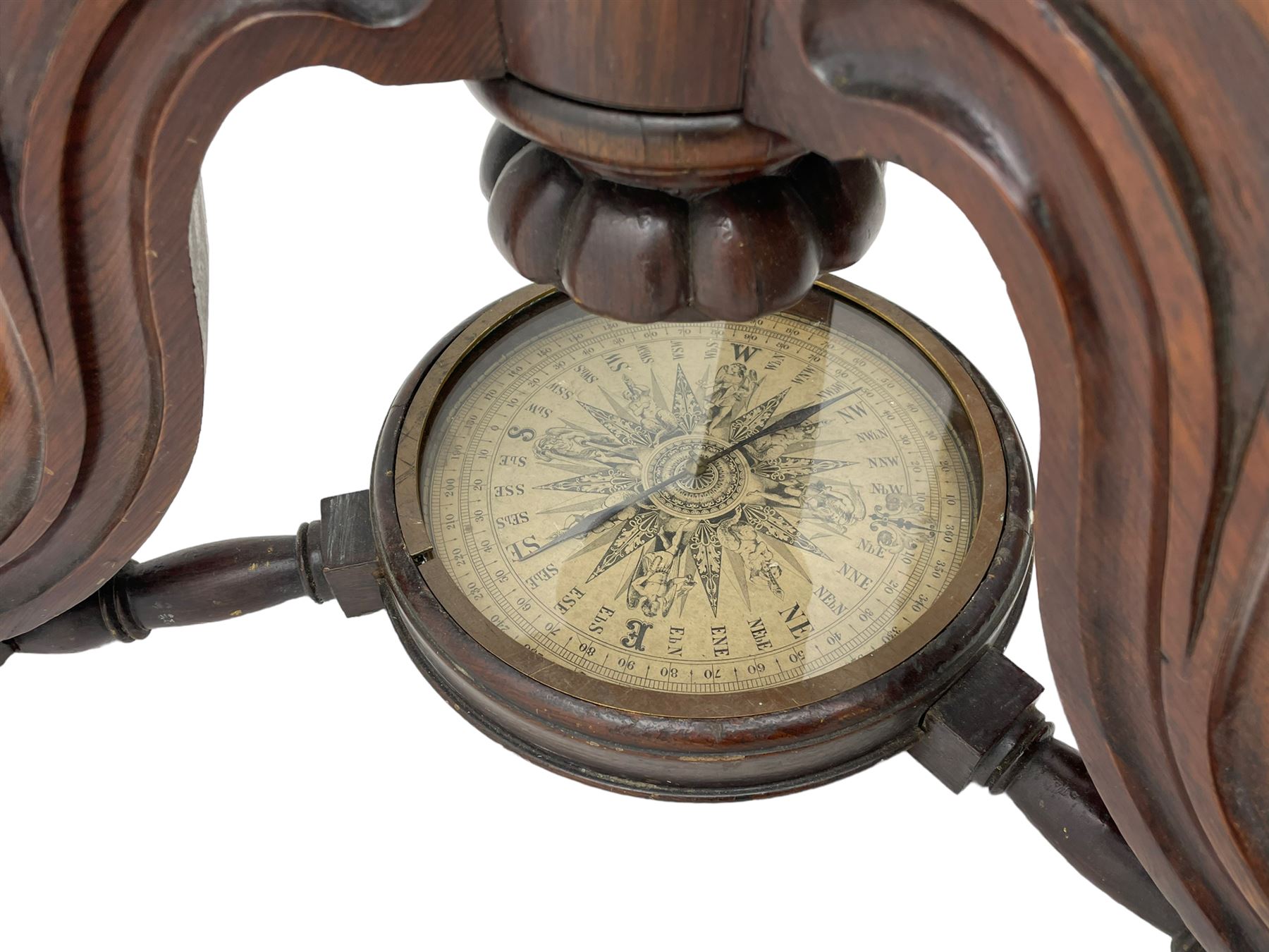 19th century brass terrestrial armillary sphere on rosewood base, lobe carved column on three splayed supports with scrolled carved terminals, the supports united by circular compass with turned stretchers