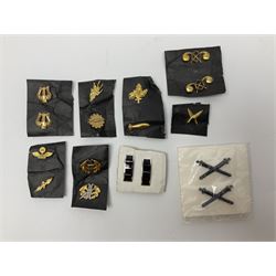 Fifty US rank badges and trade badges; WW2 and Vietnam period; predominantly on sale cards