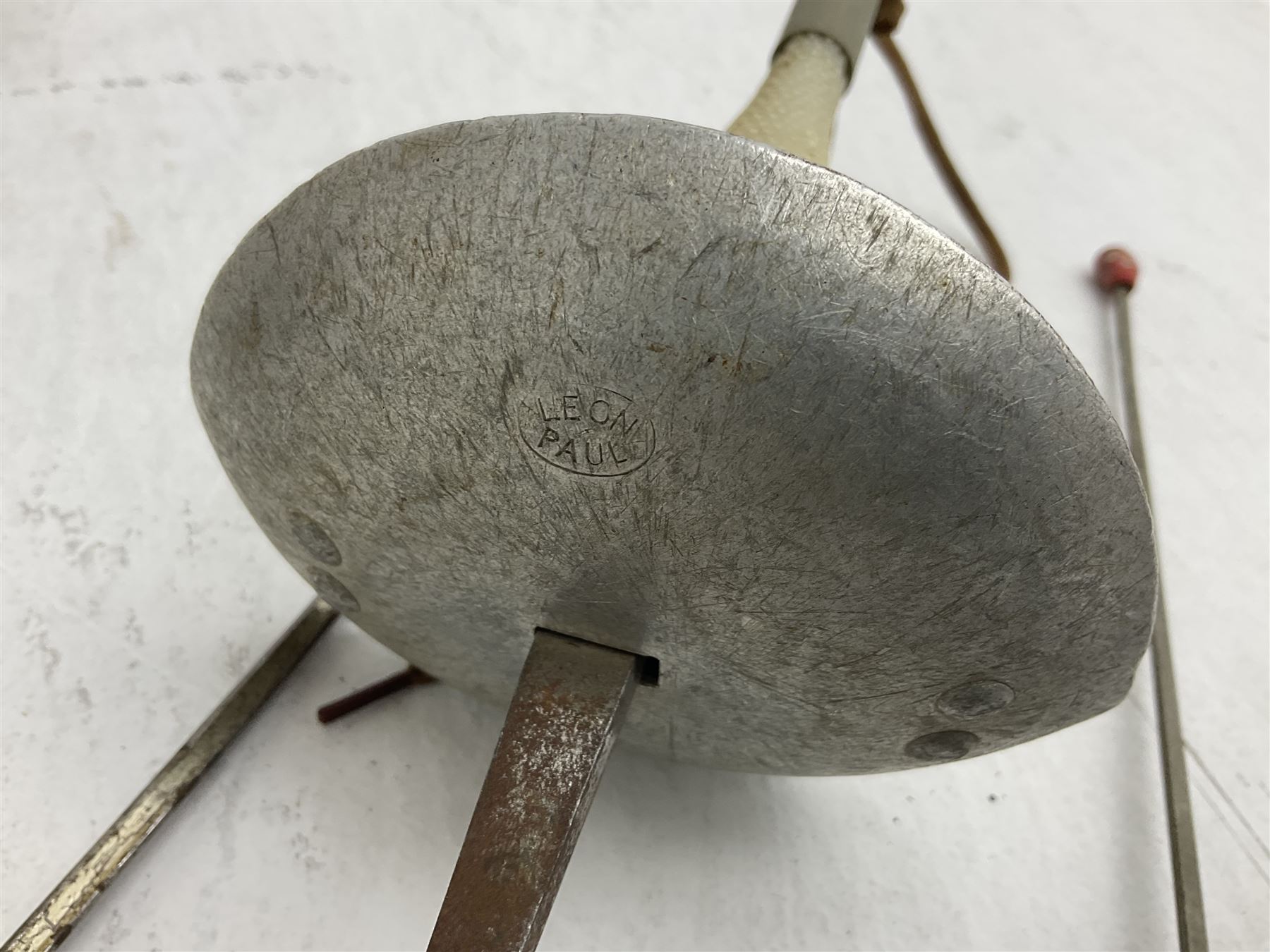 20th century Indian Tulwar sword with 71cm plain curving steel blade and iron hilt with extended langets, knopped grip and spiked pommel; in canvas covered wooden scabbard L87.5cm overall; together with five fencing swords comprising four foils and one epee, three marked Leon Paul, one in carrying case (6)