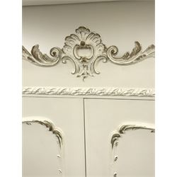 Late 20th century French style white and gilt double wardrobe,  shell carved cresting rail, two doors enclosing fitted interior, shaped bracket supports