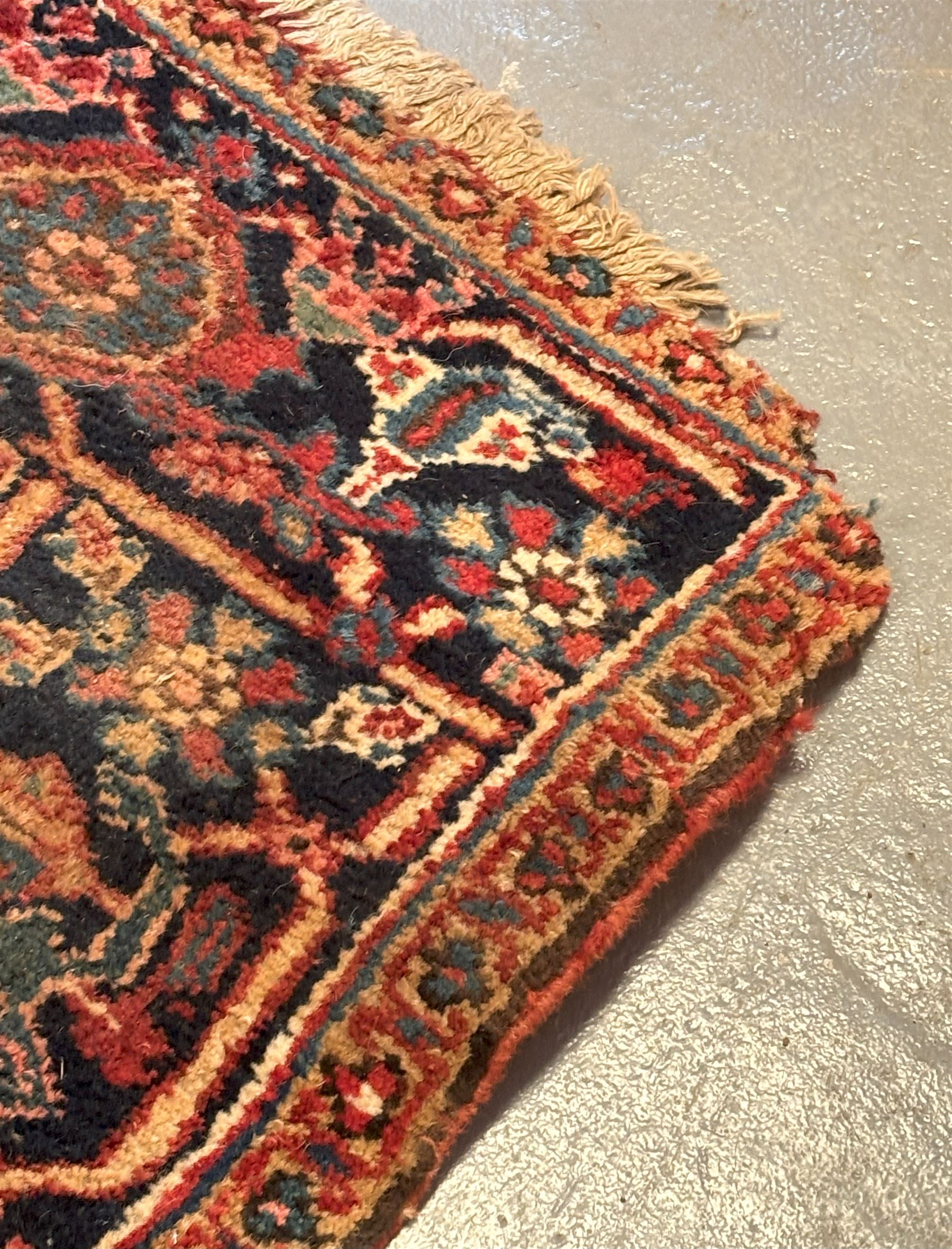 Persian Heriz red ground carpet, the field decorated with all-over geometric floral design within a guarded border, second quarter of the 20th century, 238cm x 339cm. - COLLECTION BY APPOINTMENT FROM: The White House, Thirsk Road, Easingwold, York, YO61 3NF - CALL 01723 507111 TO ARRANGE