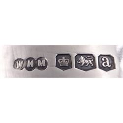 Early 20th century silver three piece tea service, comprising teapot, twin handled sucrier, and milk jug, each of oval part fluted form, the teapot with ebonised handle and finial, hallmarked Sheffield 1918, maker's mark WHM