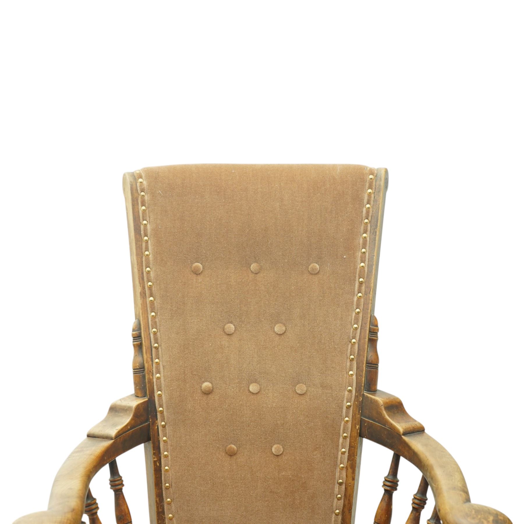 Near pair of late 20th century oak high back armchair, upholstered in brown fabric with buttoned back and close-nailed borders, shaped arms on turned supports, over a stuff-over seat, raised on turned legs united by stretchers