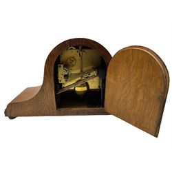 A light oak cased Tambour clock with a German 8-day movement sounding the quarters and hours on gong rods, with a 6” silvered dial , Arabic numerals and minute track, steel spade hands within a spun brass bezel and convex glass.
With pendulum. 








