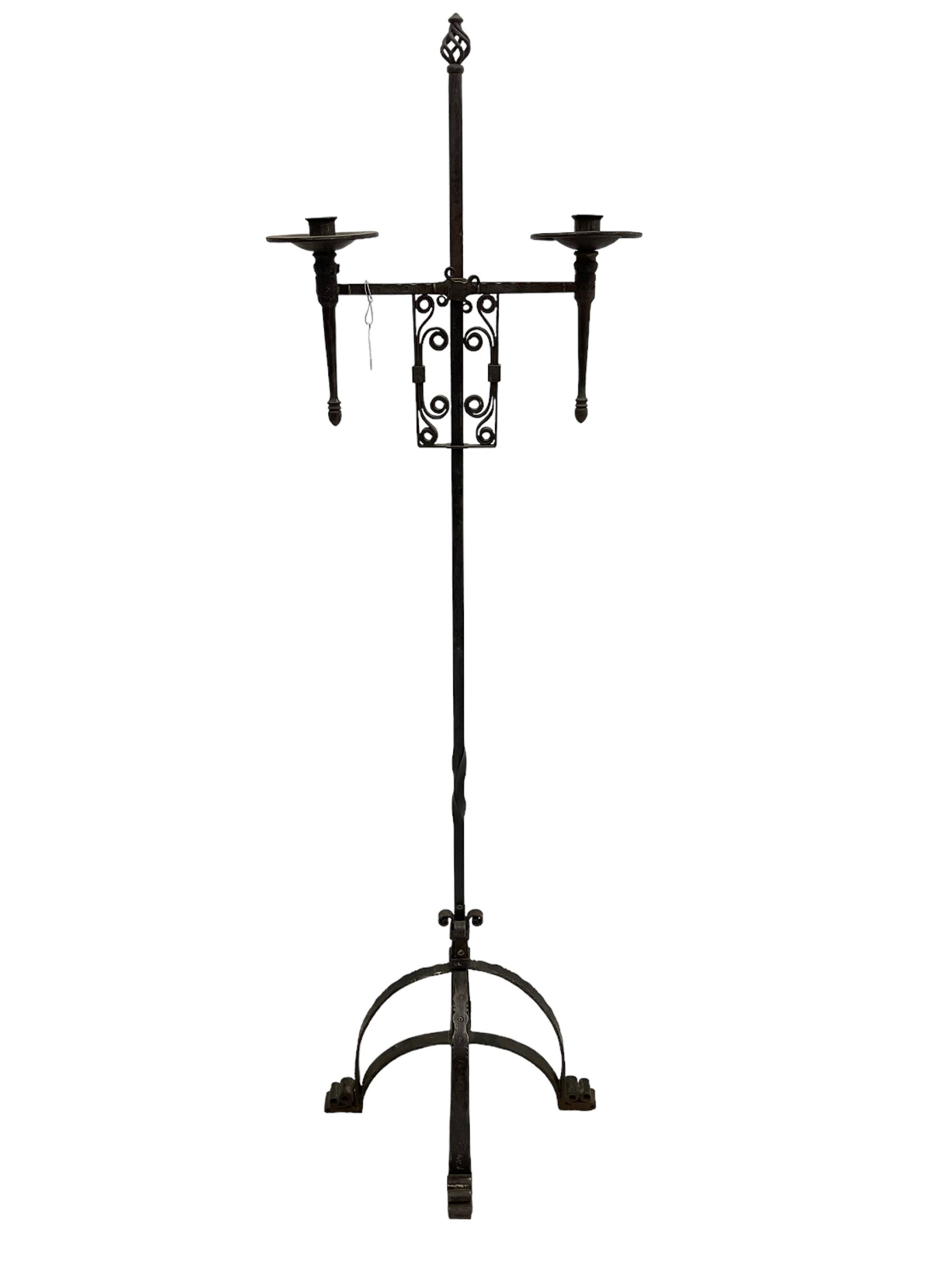Ironwork candle holder stand, with stamped decoration, adjustable two branch sconces with scrolled iron work, twist stem with arched supports with scrolled terminals