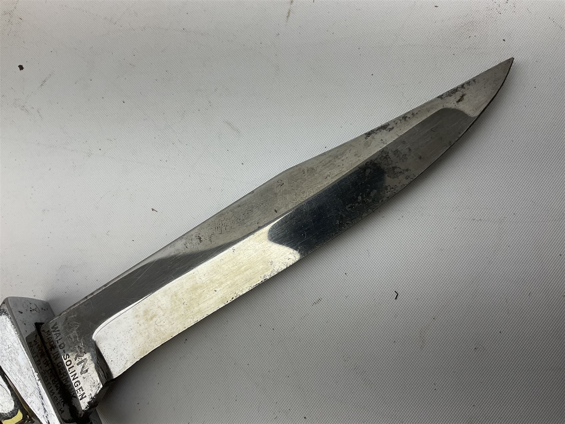 German ERN Wald-Solingen Art Deco style hunting knife with 13cm Bowie type blade and chrome fittings with antler grip; in leather sheath L24.5cm overall; and Bianchi Rastignano Aeronautica Militare combat knife with 15.5cm Bowie type saw-back blade and stacked leather grip (2)