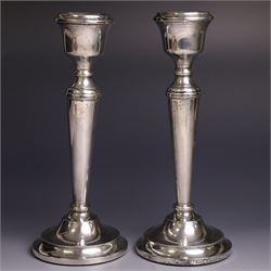 Pair of late 20th century silver candlesticks, each with tapering stem and upon circular b...
