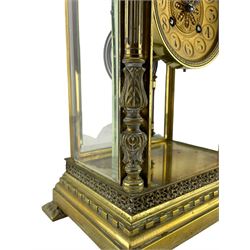 Lloyd Payne & Amiel - Parisian early 20th century four glass mantle clock c1905, with a Samuel Marti 8-day two train movement and twin file mercury pendulum, cast brass case with a flat top and dentil cornice beneath, decorative applied frieze supported by four tulip columns with capitals, conforming stepped plinth raised on pad feet with acanthus leaf motifs, gilt dial with a decorative and pierced centre, Arabic numerals within circular cartouche, steel fleur di Lis hands and embossed bezel, rack striking movement, striking the hours and half hours on a coiled gong.
Lloyd Payne and Amiel are recorded as retailers of quality clocks and barometers in Manchester c1890.
