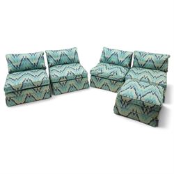 Parker & Farr - 1970s modular sofa suite comprising four chairs and footstool, reclined back with loose seat cushion, upholstered in turquoise flame-stich fabric with skirt, on castors
