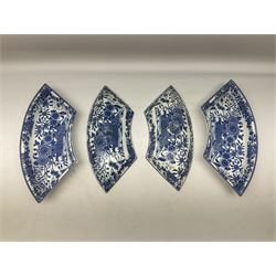 Pair of early 19th century blue and white pearlware supper segments and covers, probably Minton, with lion head finials and transfer decorated with baskets of flowers, L38cm