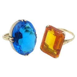 Large 10ct gold oval London blue topaz ring and one other yellow stone set ring, stamped 9ct
