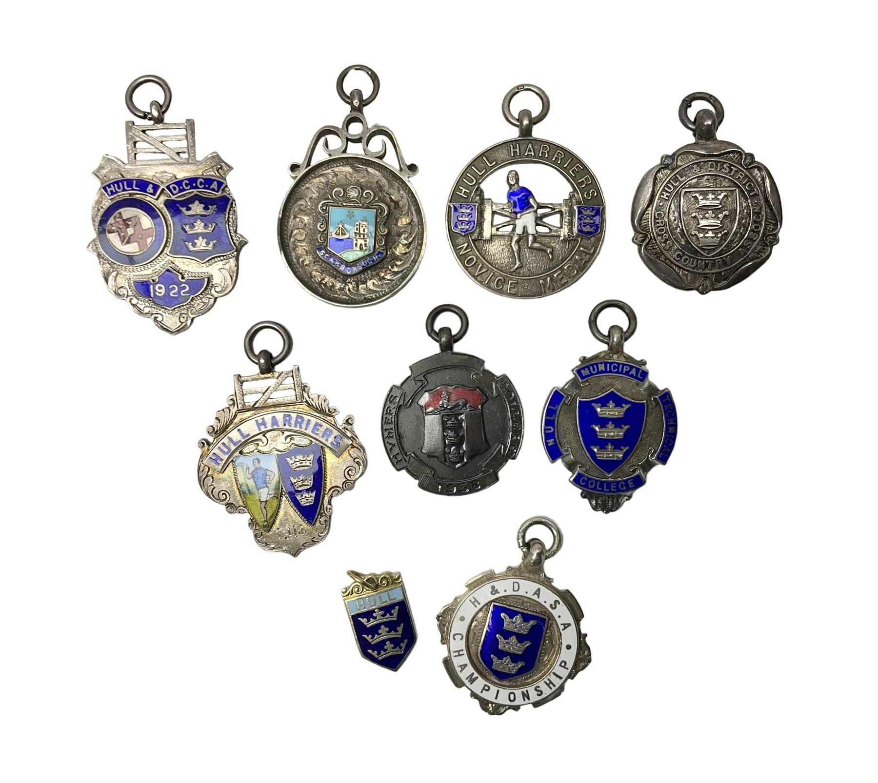 9ct gold enamel 'Hull' charm, together with eight silver fob medallions, six with enamel decoration relating to Hull and one Scarborough example, all hallmarked 