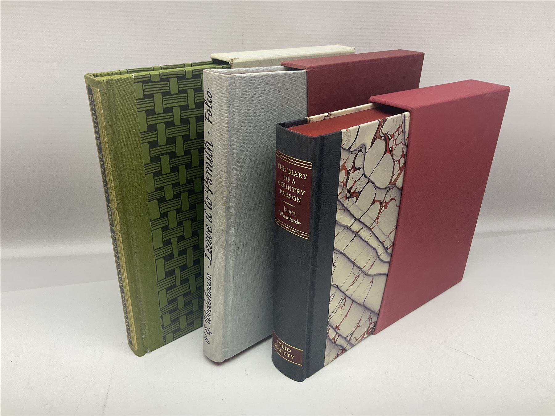 Seven Folio Society books, including The Divine Comedy, Charles Dickens Christmas Book, The Proud Tower, etc, all with outer sleeves