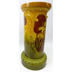  Late Victorian Bretby jardiniere stand of cylindrical form, with reserve panels painted with iris' within a scroll moulded frame, impressed no. 800, H64cm    