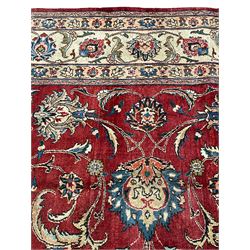 North East Persian signed meshed carpet, the red ground field with interlacing branch design and decorated with plant motifs, ivory ground border with similar repeating design, the guard bands decorated with flower heads, signature panel to one end