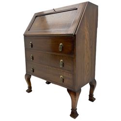 Early 20th century oak fall front bureau, fitted with three drawers, on angular cabriole supports