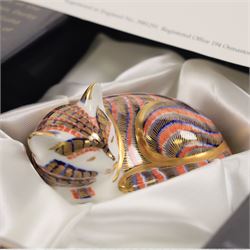 Three Royal Crown Derby paperweights, comprising Seated cat, Rabbit and Sleeping cat, all with gold stoppers 